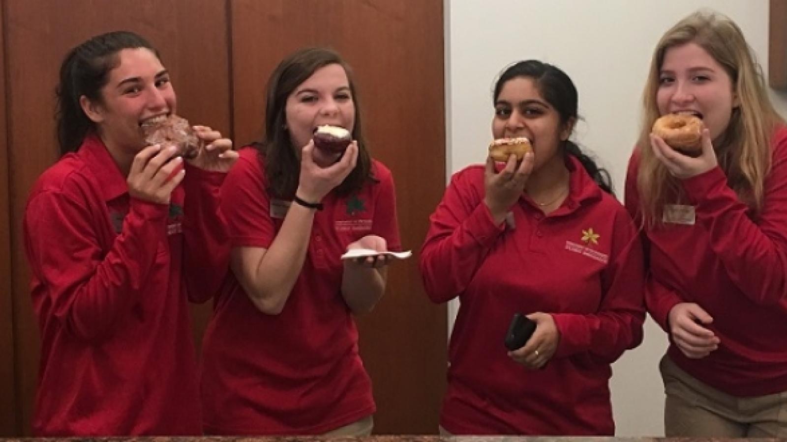 Students eating donuts