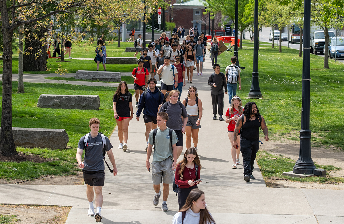 Students walking on campus on a sunny day
