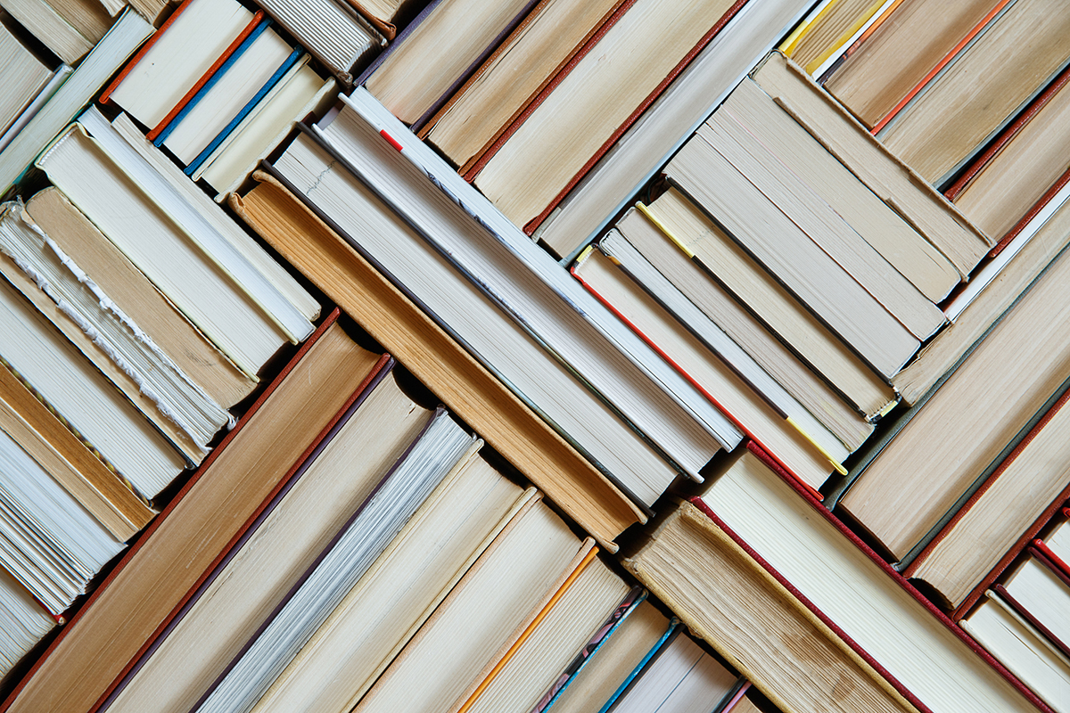 Overhead view of books arranged in a geometric pattern