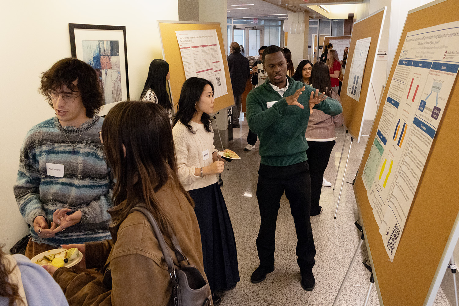 Students present research posters in the Psychology Building lobby