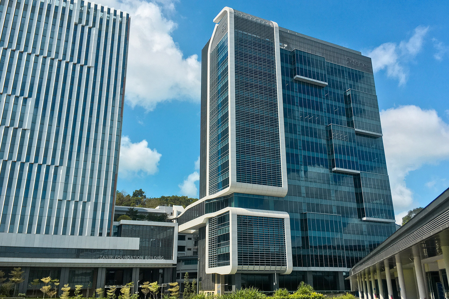 Glass building against blue sky at National University of Singapore