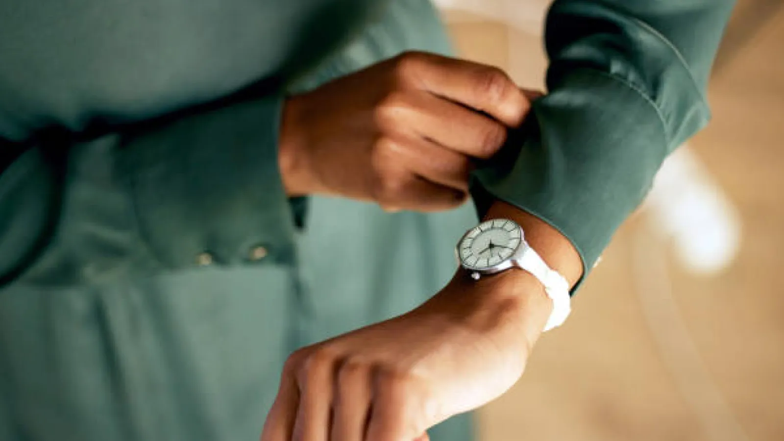 A person checking their wrist watch