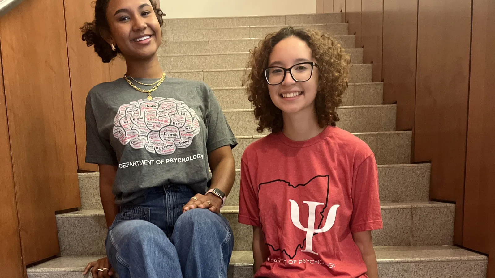 Two Students Wearing Psychology-Themed T-Shirts