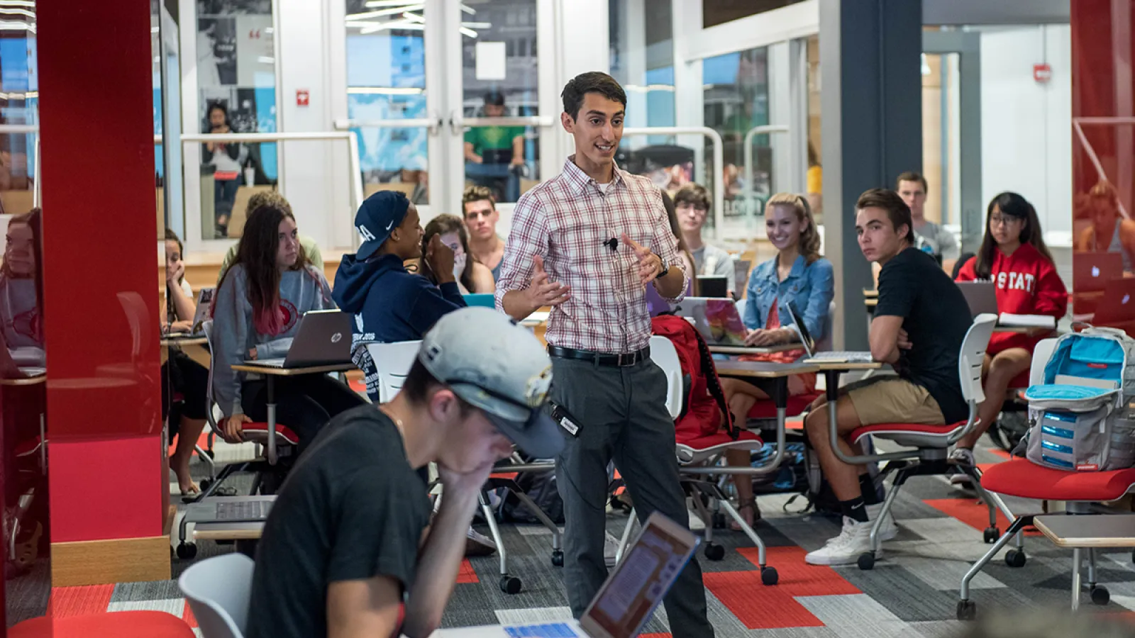 A man lectures in a classroom