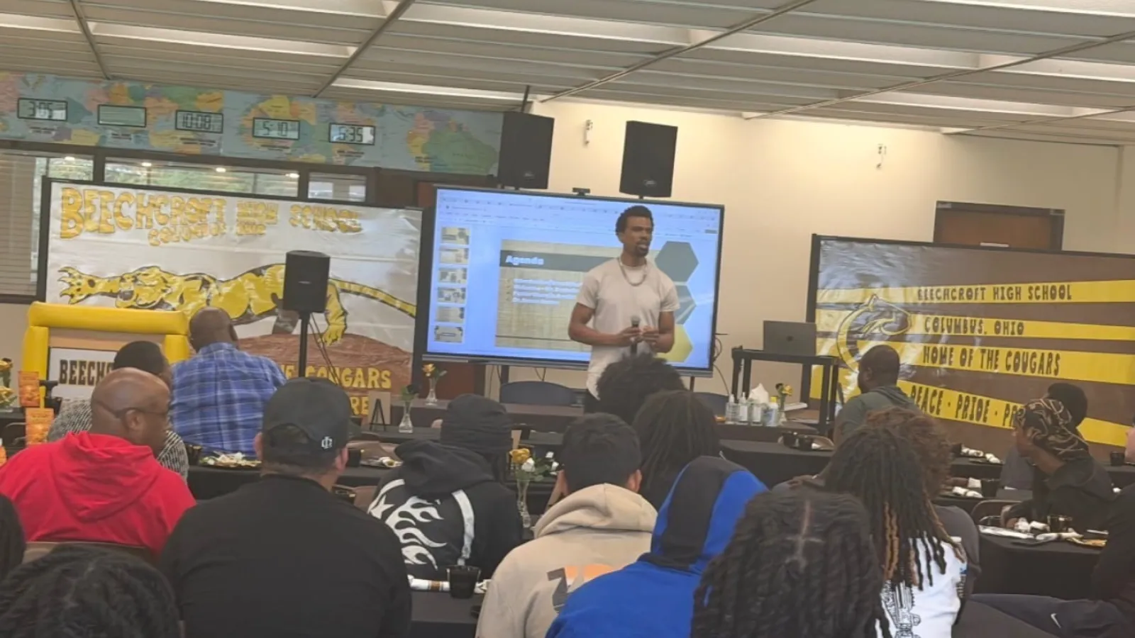 Devon Carter speaking in front of a room of seated students