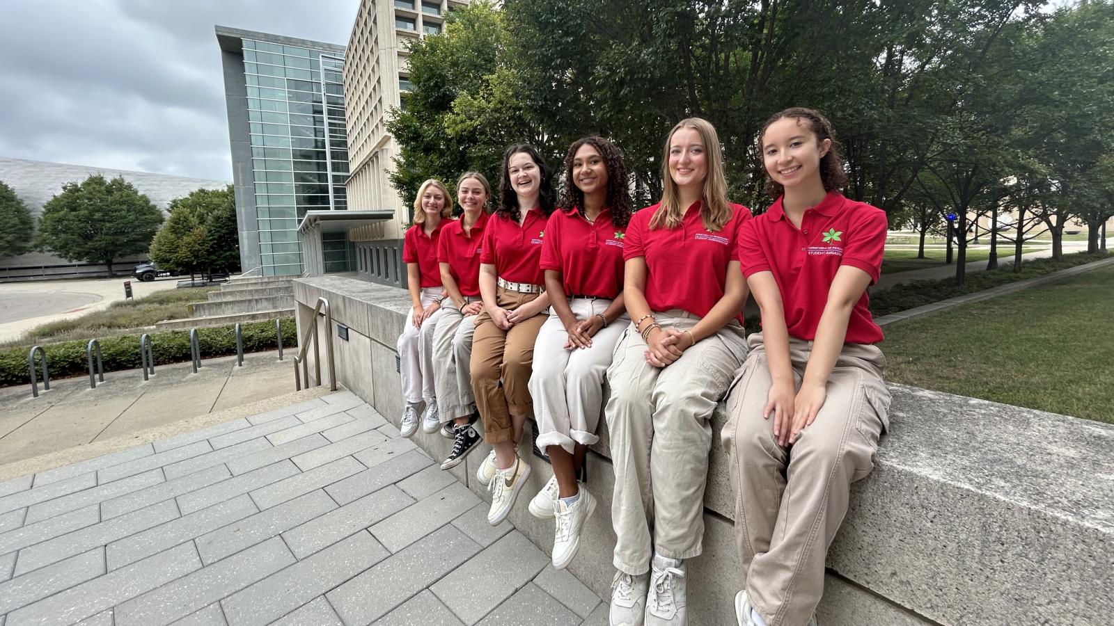 2024_2025 Ambassadors outside in red polos